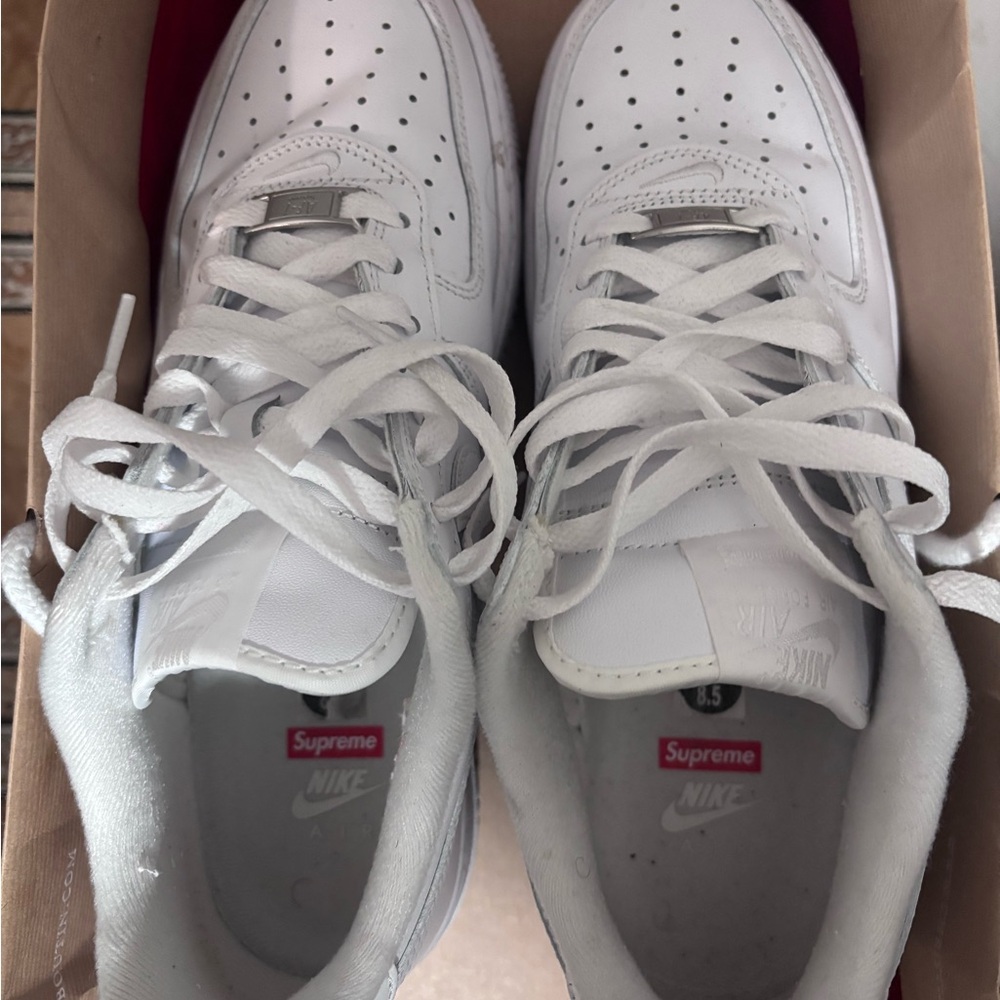 Supreme White Low-Top Sneakers with Red Logo